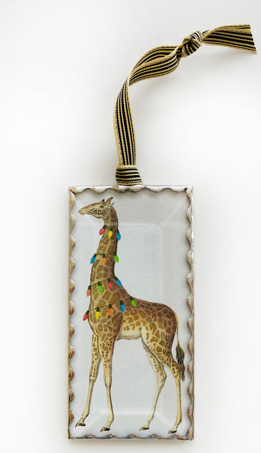 Decorative ornament with a giraffe design on a white background
